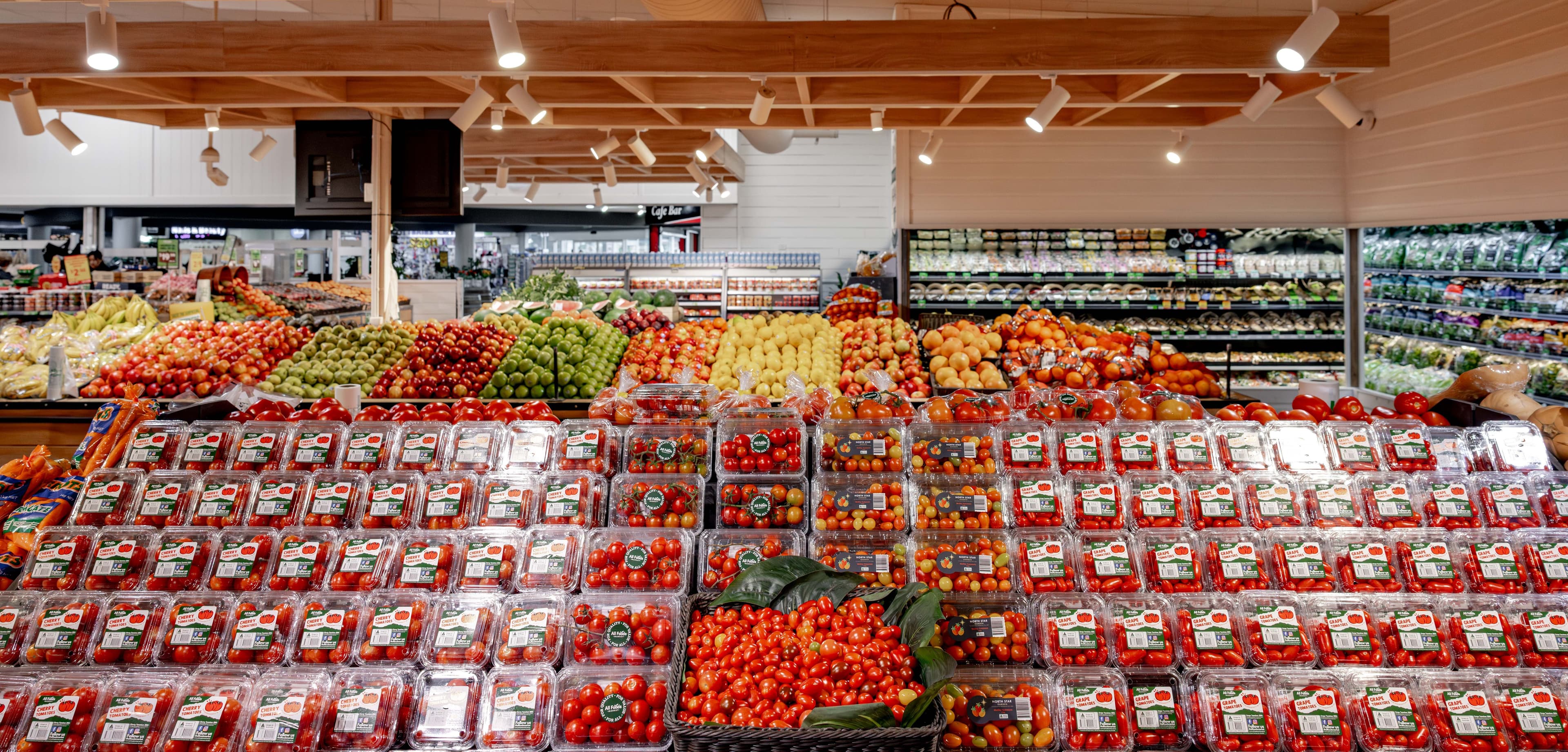 Variety of tomatoes in plastic containers at Allfoods Leeming store